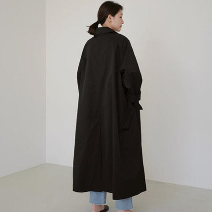 Women’s long swing coat with an A-line cut and dropped shoulders