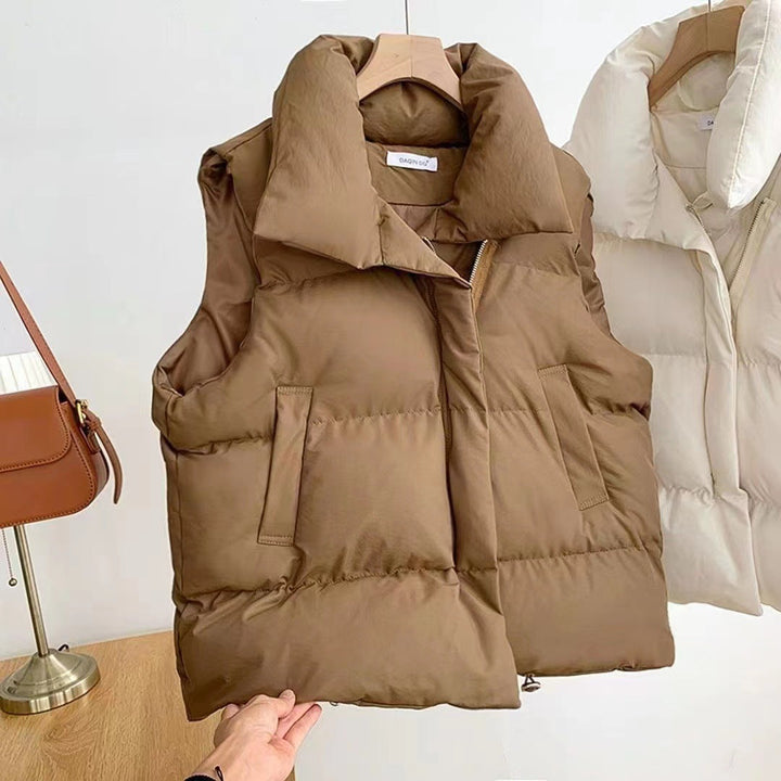 Women's padded quilted vest with shawl collar and adjustable drawstring hem