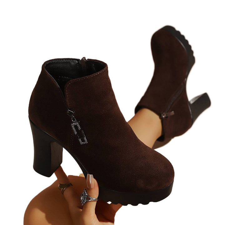 Women’s ankle boots with a moderate block heel and zipper