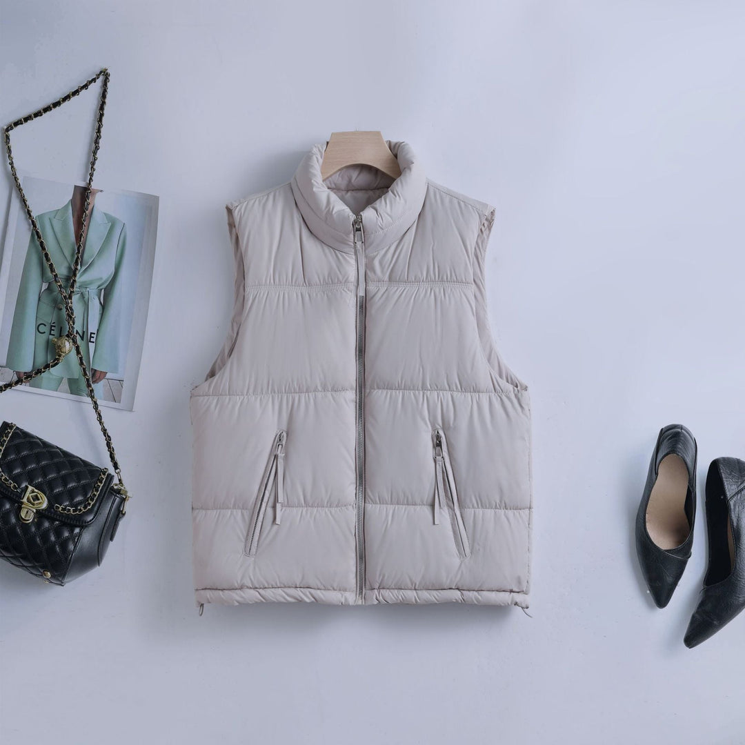 Women’s padded quilted vest with a high stand-up collar and two-way zipper