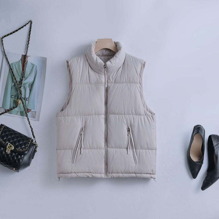 Women’s padded quilted vest with a high stand-up collar and two-way zipper