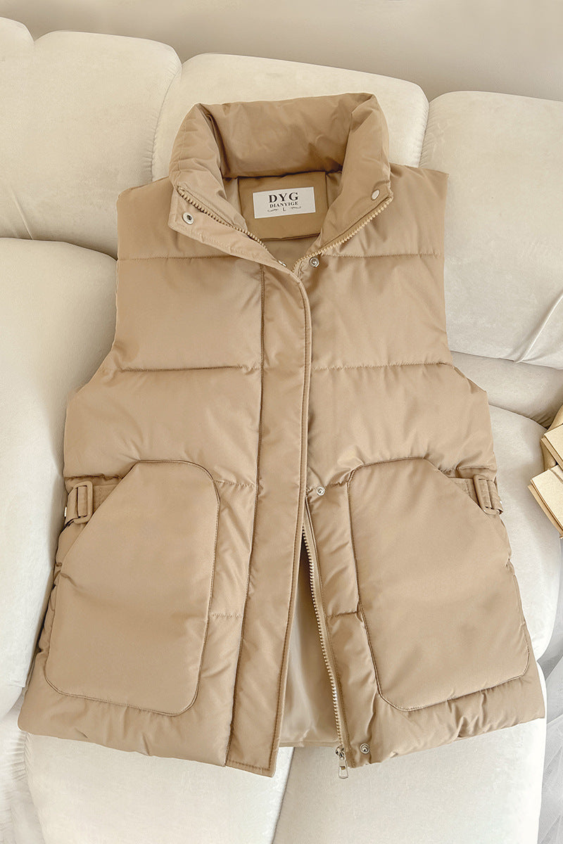 Women’s padded utility vest with stand-up collar and large flap pockets