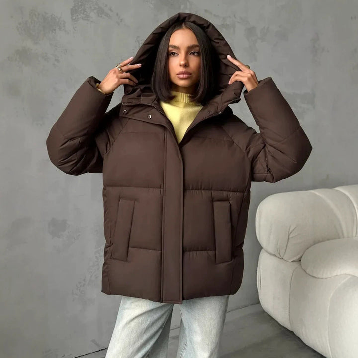 Women's oversized quilted jacket with a hood and integrated pockets