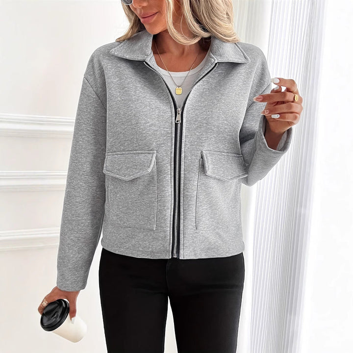 Women's fleece jacket with a zipper and flap pockets