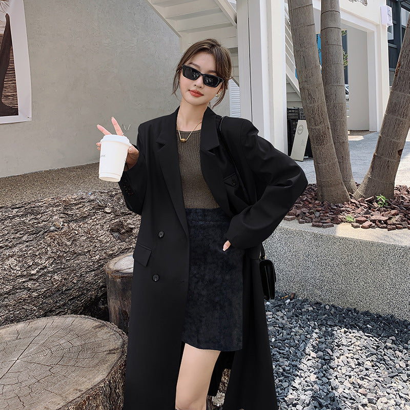 Women’s double-breasted oversized trench coat with lapels and an elongated cut