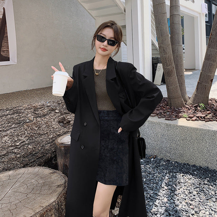 Women’s double-breasted oversized trench coat with lapels and an elongated cut
