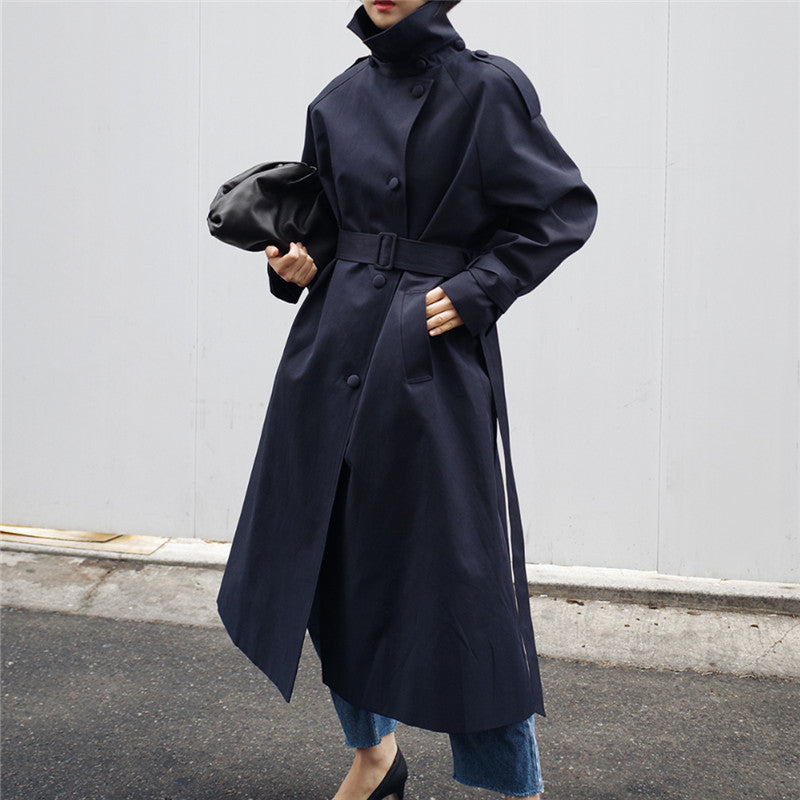 Women's long trench coat with waist belt and high stand-up collar