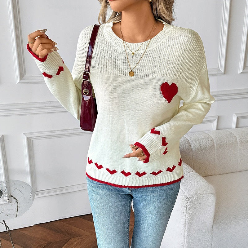 Women's sweater with a round neckline, heart intarsia, and ribbed cuffs