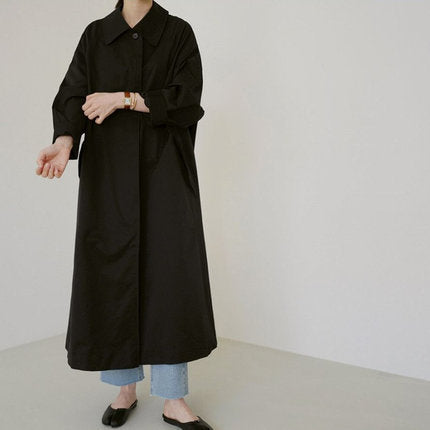 Women’s long swing coat with an A-line cut and dropped shoulders