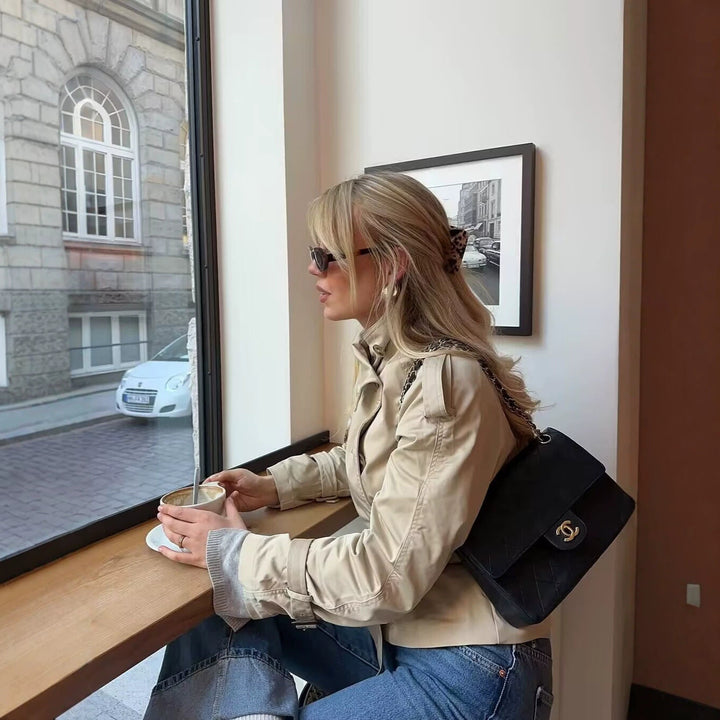 Women's trench jacket with belt and double-breasted button closure