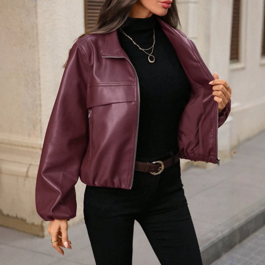 Women's cropped faux leather jacket with zippered pockets and a fitted cut