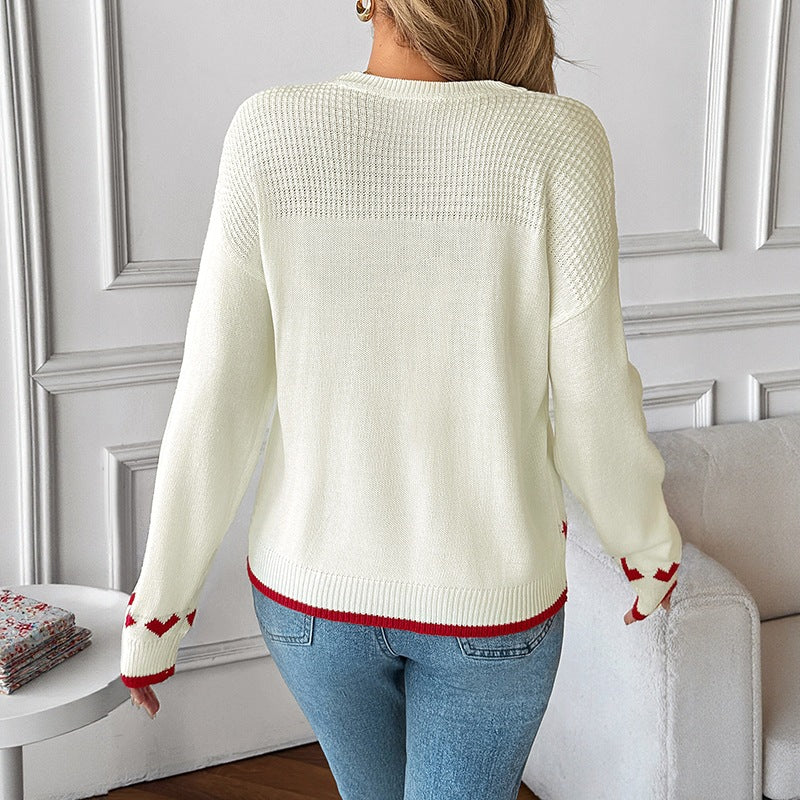 Women's sweater with a round neckline, heart intarsia, and ribbed cuffs