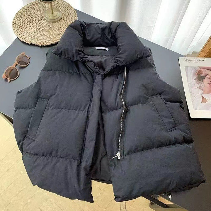 Women's padded quilted vest with shawl collar and adjustable drawstring hem