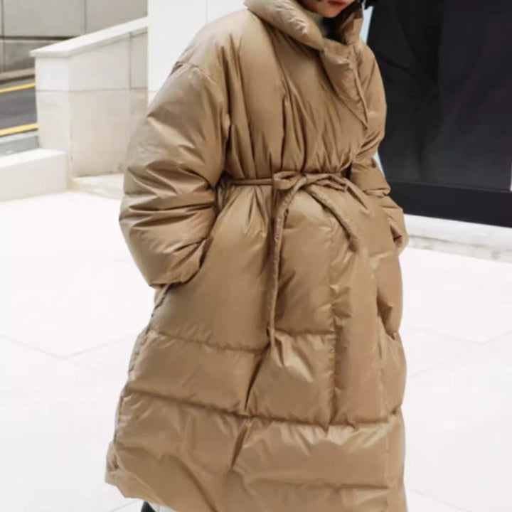 Women’s longline parka with a wrap belt and voluminous sleeves