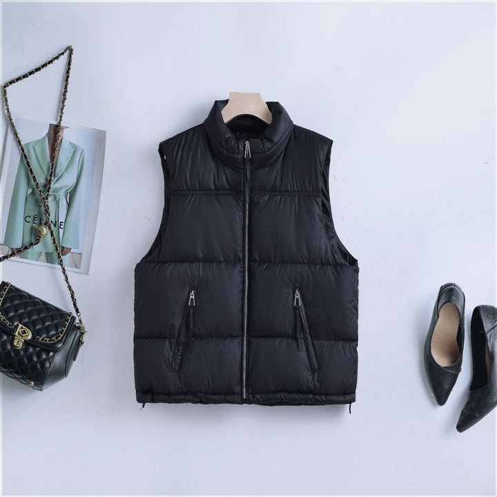Women’s padded quilted vest with a high stand-up collar and two-way zipper
