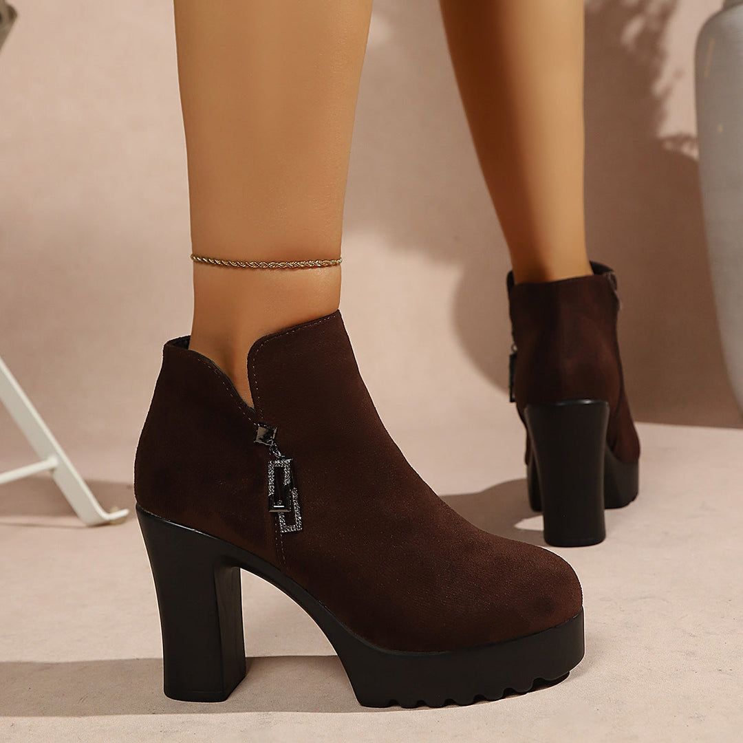 Women’s ankle boots with a moderate block heel and zipper
