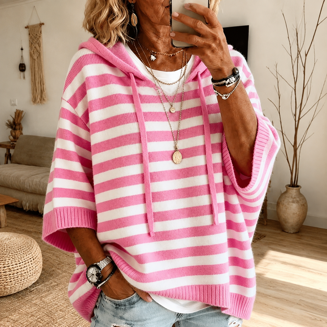 Women's hooded poncho sweater with drawstring and striped pattern