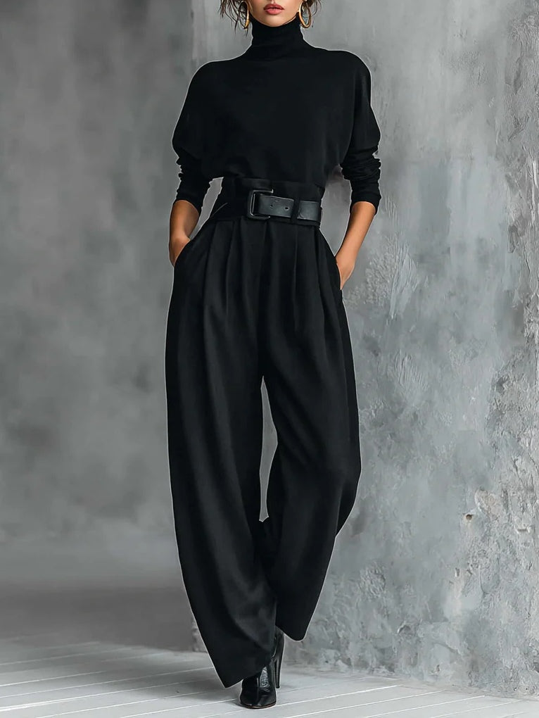 Black long-sleeved turtleneck top and straight-cut trousers with a belt
