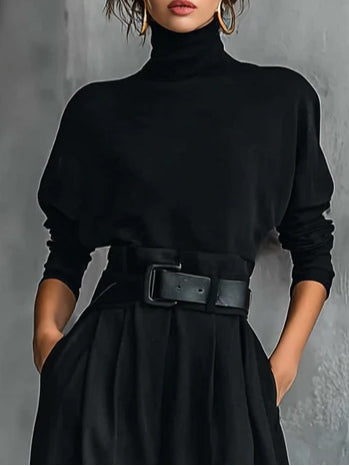 Black long-sleeved turtleneck top and straight-cut trousers with a belt
