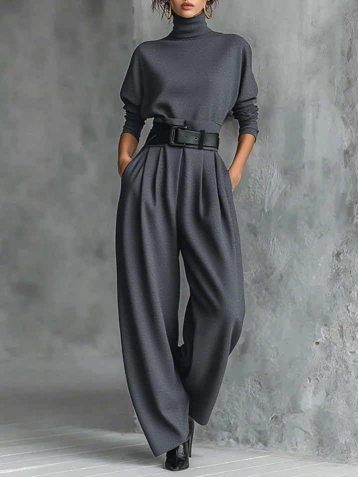 Black long-sleeved turtleneck top and straight-cut trousers with a belt
