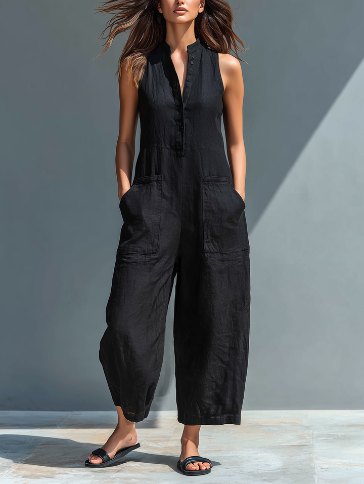 Minimalist women's jumpsuit with a stand-up collar, button placket, and a casual, loose fit