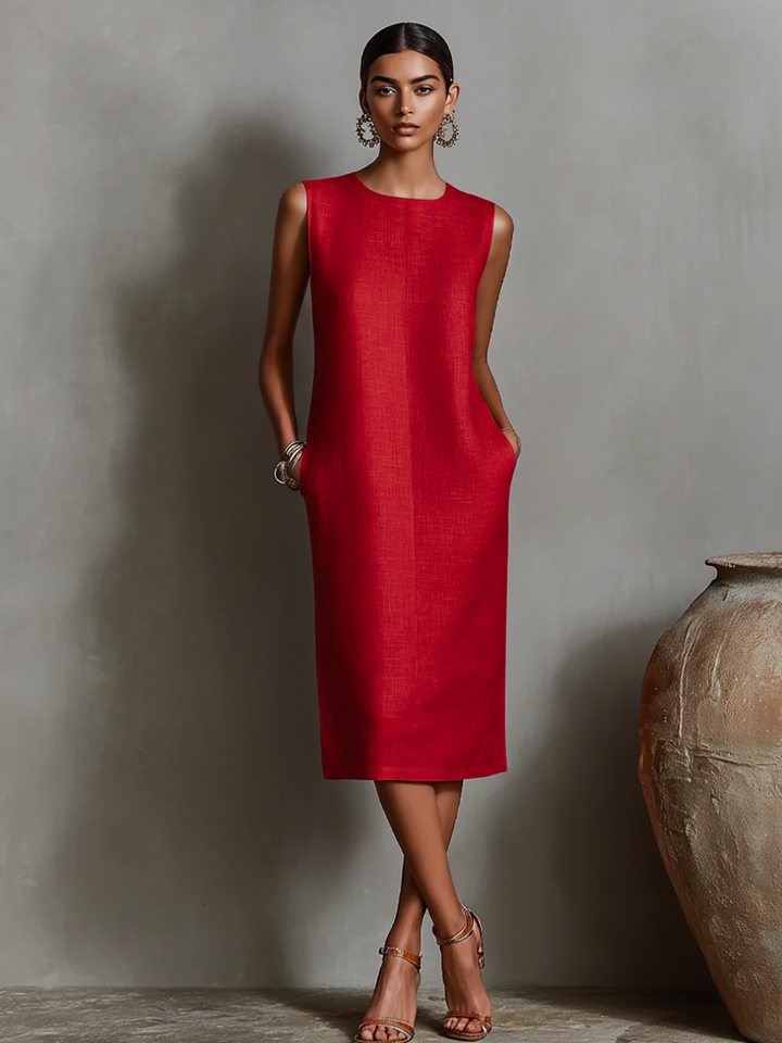 Women's orange sheath dress with sleeveless crew neck and side pockets, timeless minimalist-elegant style