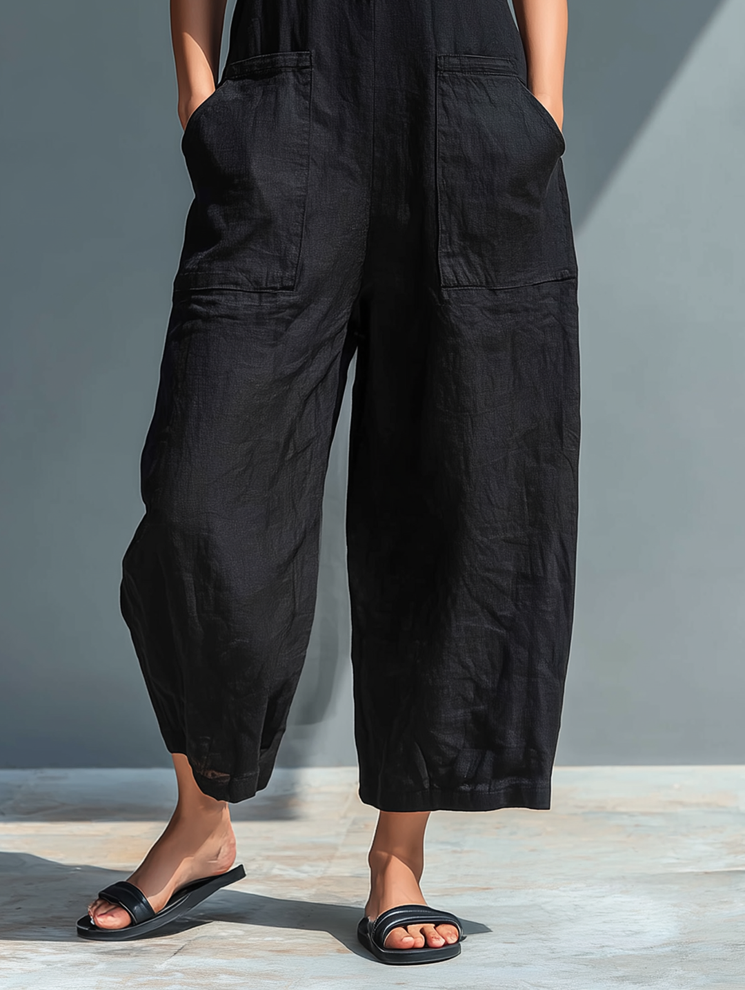 Minimalist women's jumpsuit with a stand-up collar, button placket, and a casual, loose fit
