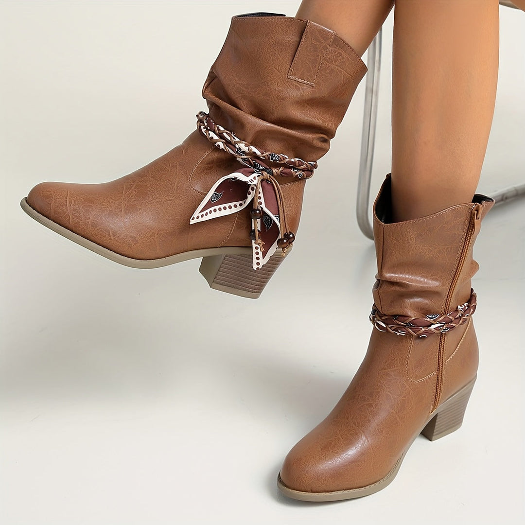Idunn | Women’s ankle boots in textured leather with a Western-style wrap detail