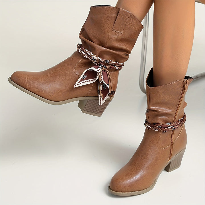 Idunn | Women’s ankle boots in textured leather with a Western-style wrap detail