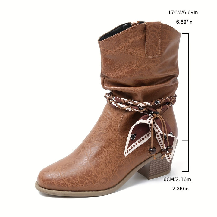 Idunn | Women’s ankle boots in textured leather with a Western-style wrap detail