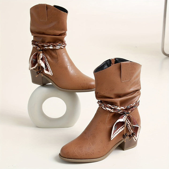 Idunn | Women’s ankle boots in textured leather with a Western-style wrap detail