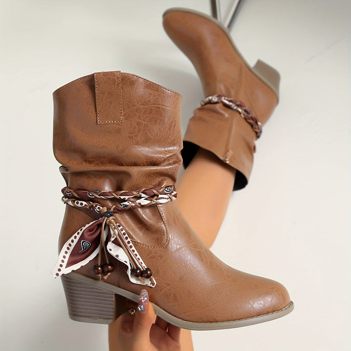 Idunn | Women’s ankle boots in textured leather with a Western-style wrap detail