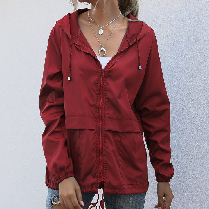 Women's raincoat with hood and drawstring