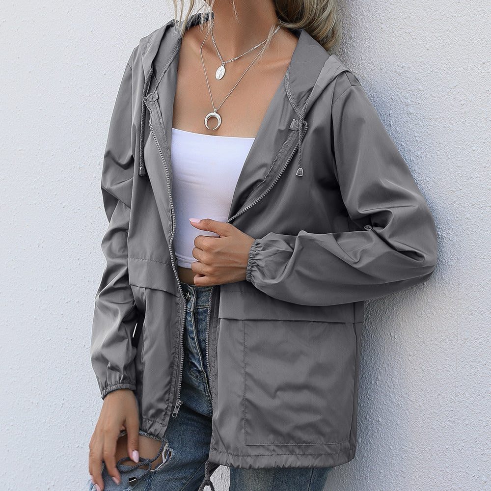 Women's raincoat with hood and drawstring