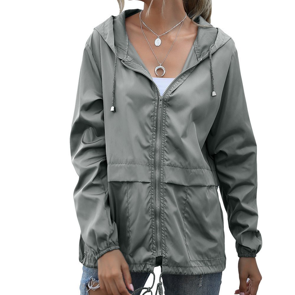 Women's raincoat with hood and drawstring