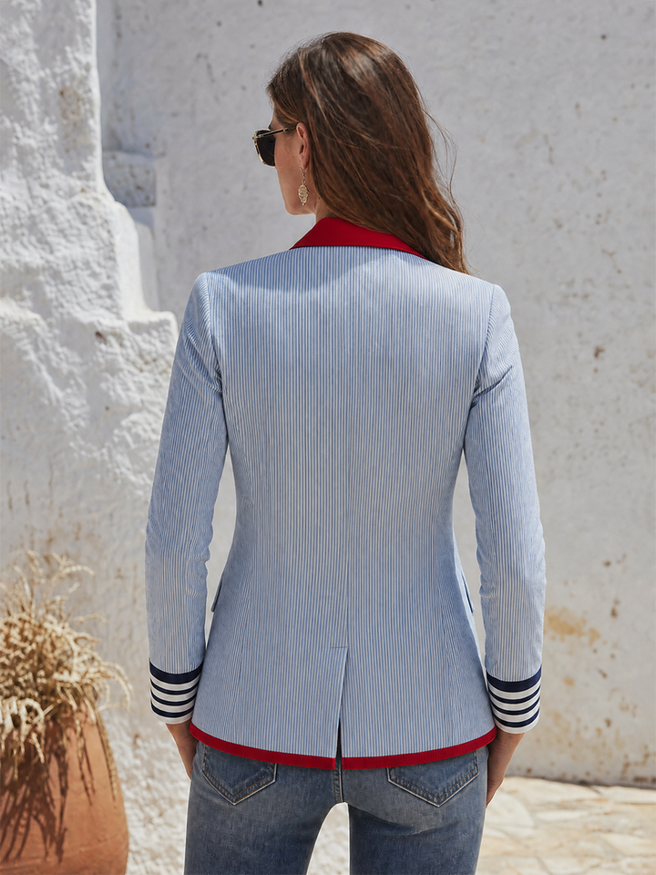 Striped women’s blazer with long sleeves, pockets, and buttons