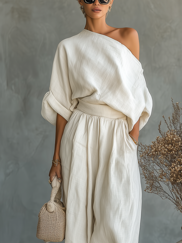 Set of off-the-shoulder, loose-fit women's blouse and slim-fit trousers
