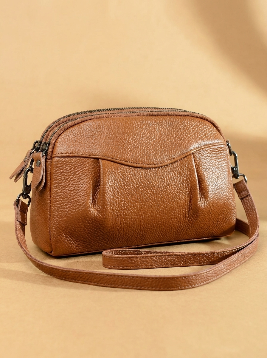 Finbjørg | Small and versatile bag in a golden cognac shade