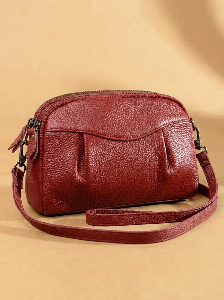 Finbjørg | Small and versatile bag in a golden cognac shade