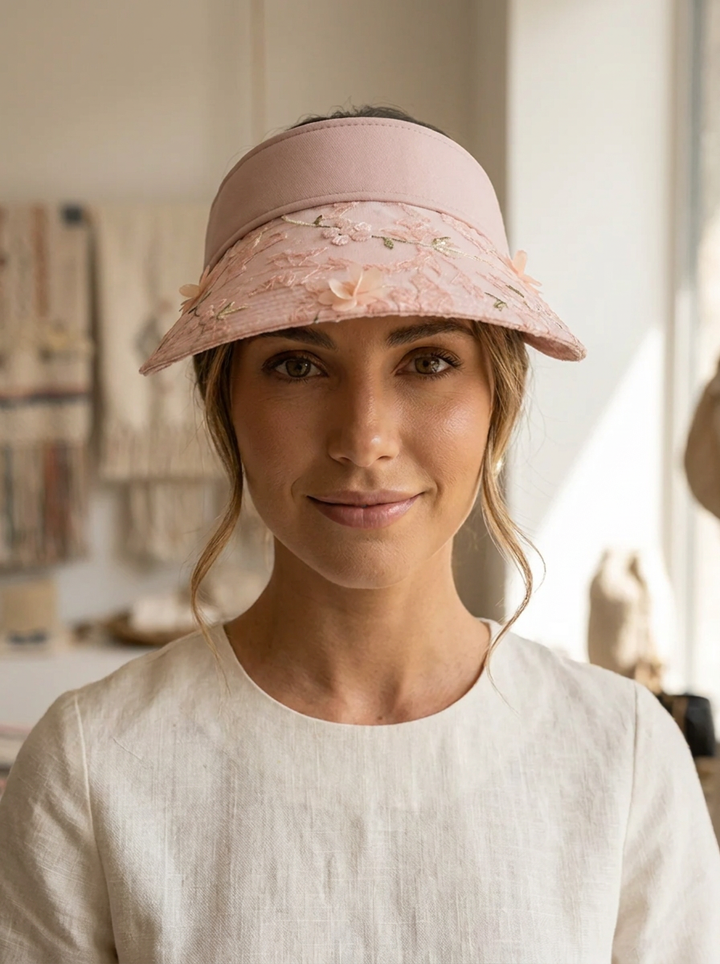 Foldable straw hat with floral accent and UV protection