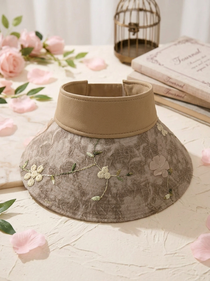 Foldable straw hat with floral accent and UV protection