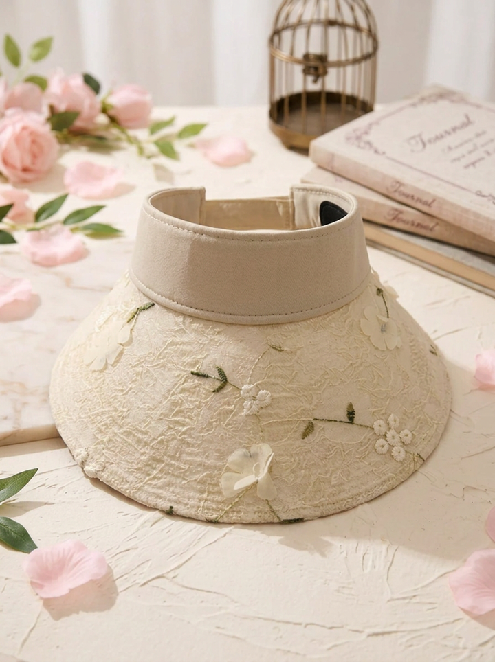Foldable straw hat with floral accent and UV protection