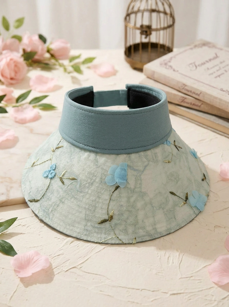 Foldable straw hat with floral accent and UV protection