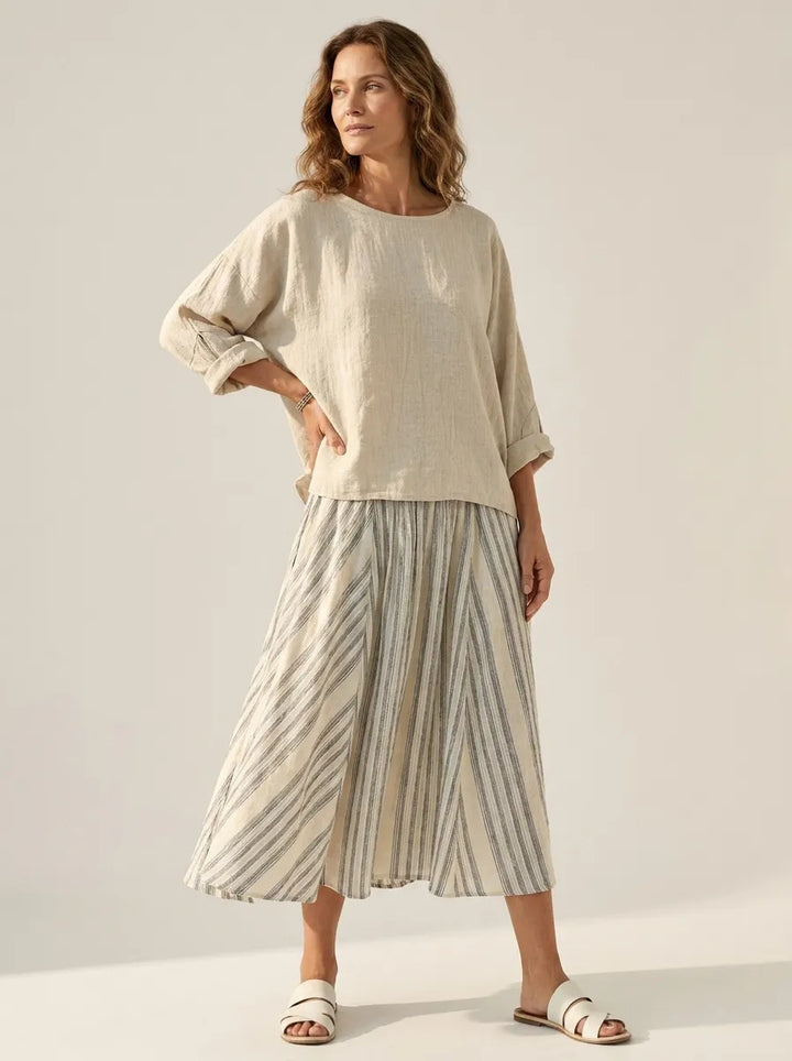 Aurora – Comfortable Blouse and Striped Midi Skirt