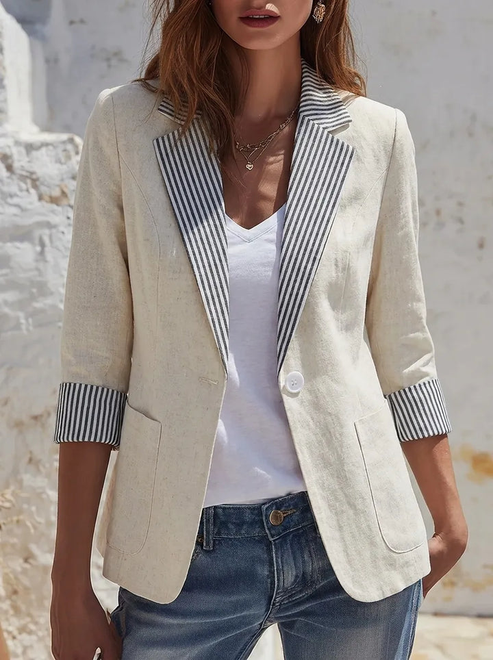 Striped women’s blazer with long sleeves, pockets, and buttons