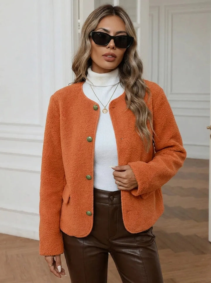 Women's jacket with gold buttons and side pockets