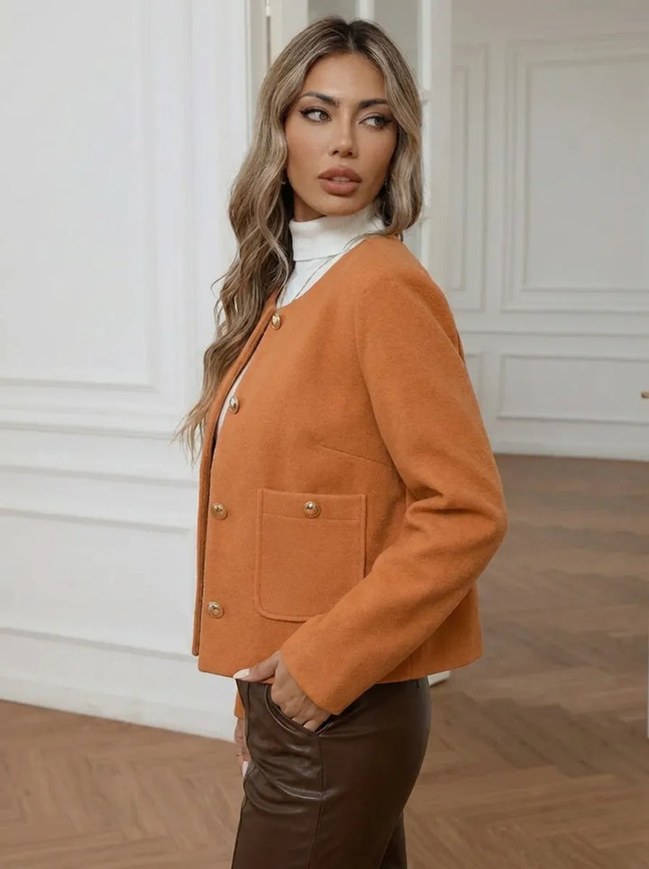 Women's jacket with gold buttons and side pockets
