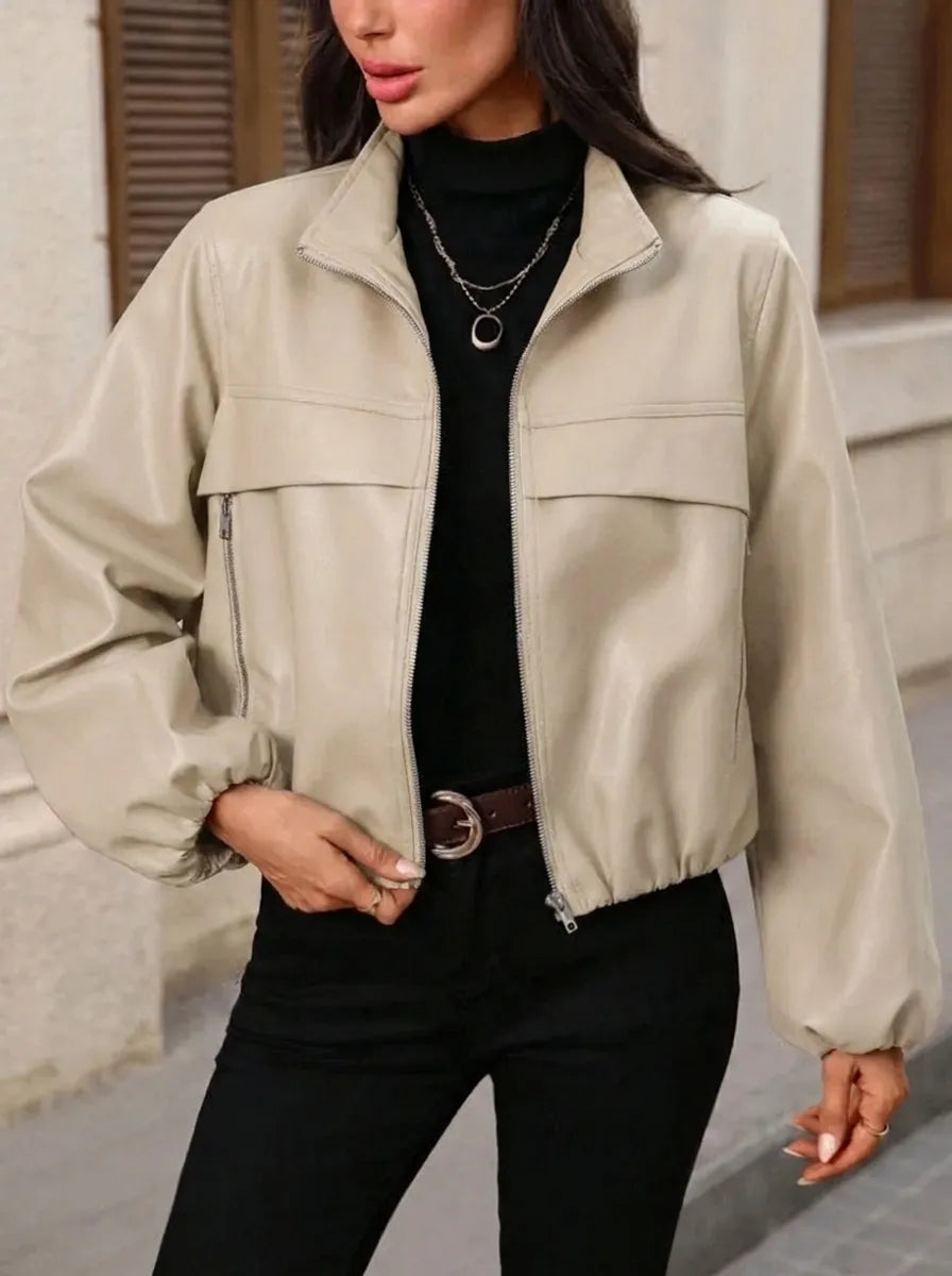 Women's cropped faux leather jacket with zippered pockets and a fitted cut