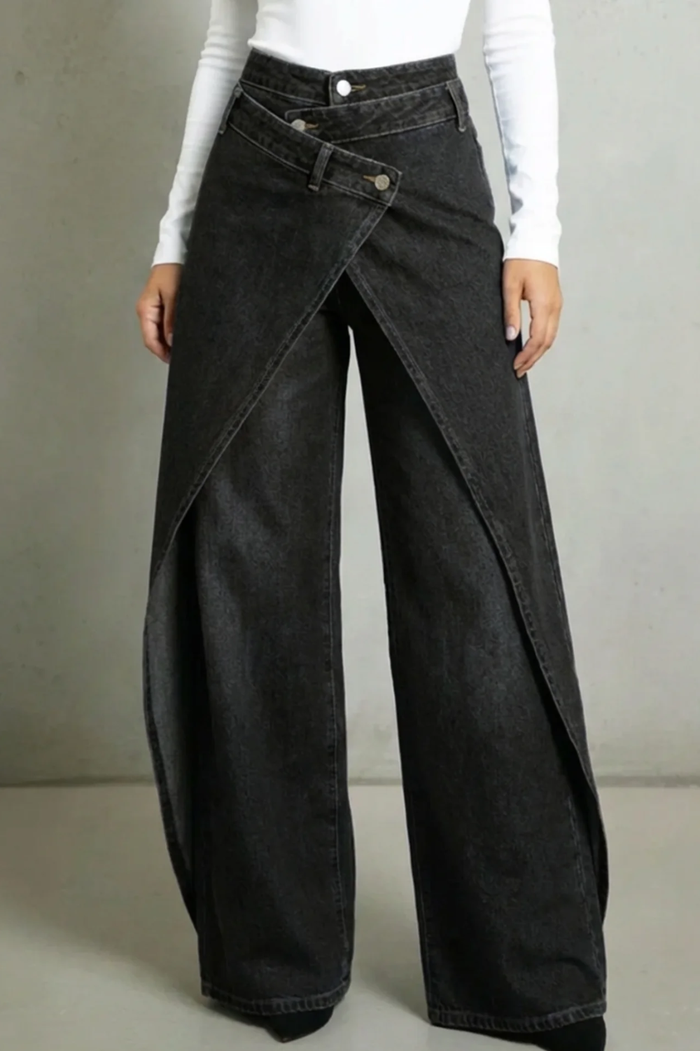 Vintage-inspired high-waisted denim jeans with a ruffled waistband and tie belt