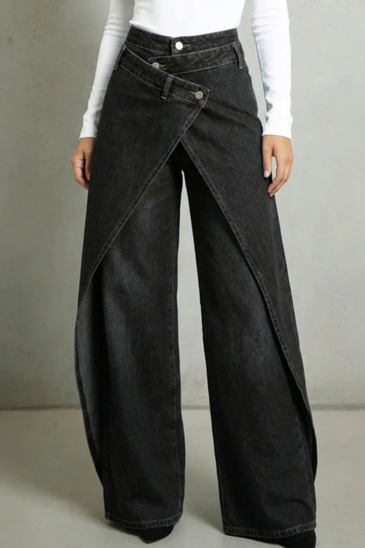 Vintage-inspired high-waisted denim jeans with a ruffled waistband and tie belt